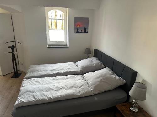 Postel nebo postele na pokoji v ubytování Formella Wartburgblick