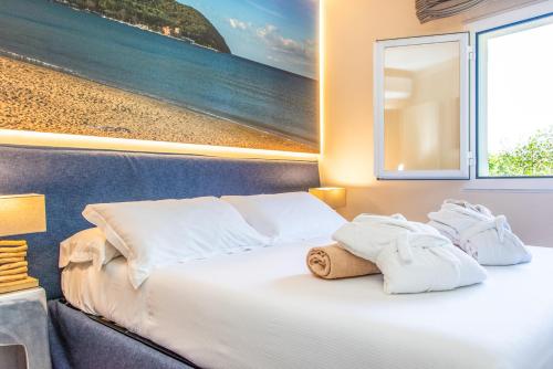 Ένα ή περισσότερα κρεβάτια σε δωμάτιο στο Resort Riva Degli Etruschi