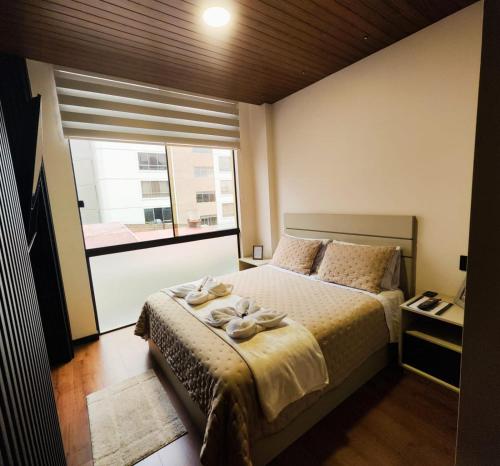 Postel nebo postele na pokoji v ubytování Departamentos Smart Design