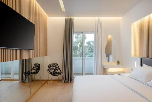 Postel nebo postele na pokoji v ubytování Kreoli Hotel