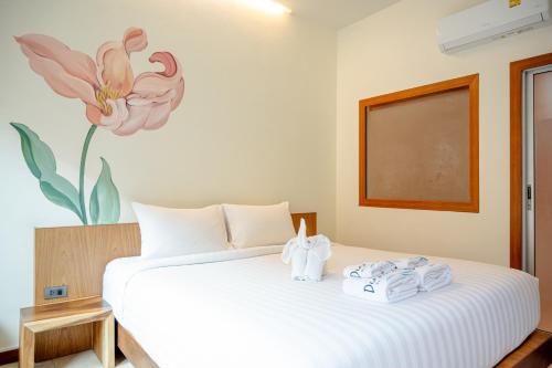Postel nebo postele na pokoji v ubytování Diamond Beach Resort