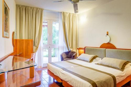 Postel nebo postele na pokoji v ubytování Hotel Riva degli Etruschi