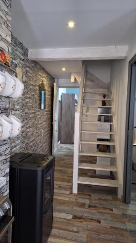 a room with a staircase and a stair case at Vacance et Cure dans Duplex 80 M2 à CERET 66400 in Céret