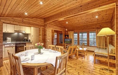 a kitchen and dining room with a table and chairs at 2 Bedroom Nice Home In Masserberg in Masserberg