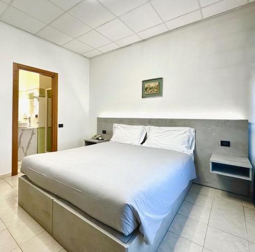 Кровать или кровати в номере Hotel Leonardo