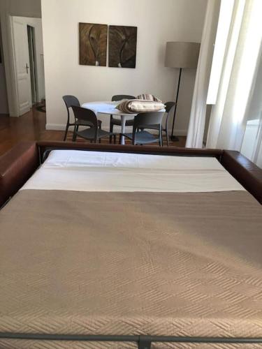 a room with a table and chairs and a dining room at Your nest at Colosseum!! in Rome