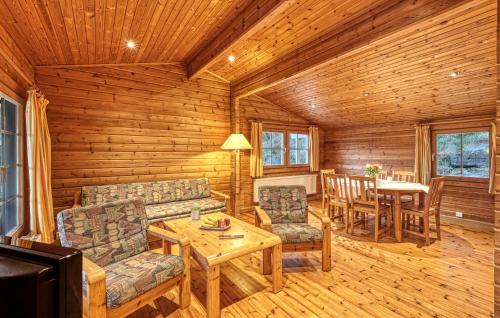 a living room with a couch and a table at Cozy Home In Masserberg With Wifi in Masserberg