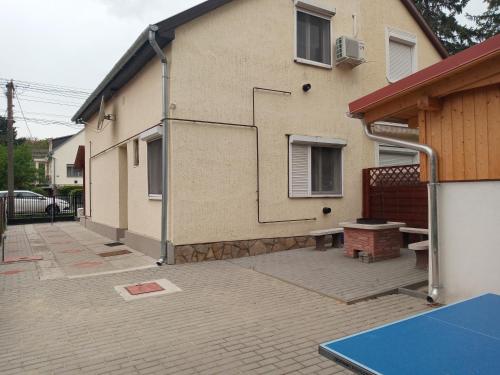 a building with a ping pong table in front of it at A whole holiday house with a garden in Fonyd for 2-10 persons in Fonyód