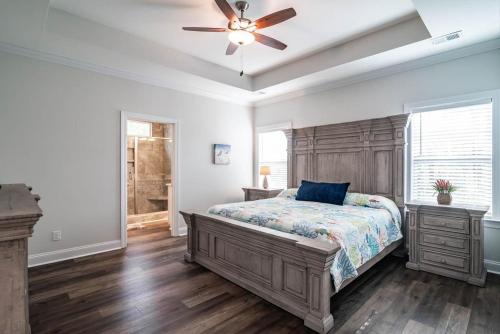 a bedroom with a bed and a ceiling fan at Island Escape Relax and Unwind in Pawleys Island in Pawleys Island