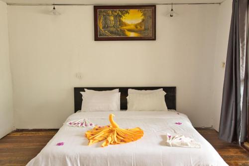 Postel nebo postele na pokoji v ubytování Koh Rong Beach Hostel and Bungalows