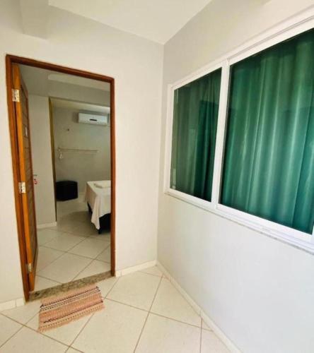 Katil atau katil-katil dalam bilik di Pousada Terral - Broadway em Canoa Quebrada