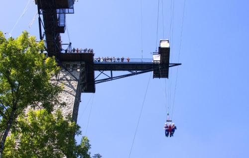 a group of people on a zip line over a bridge at Pet Friendly Home In Villiers-Fossard in Villiers-Fossard