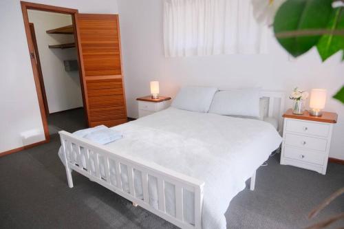 Ένα ή περισσότερα κρεβάτια σε δωμάτιο στο Sunset Beach House