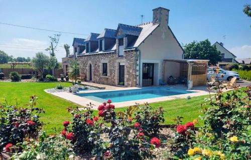 a house with a swimming pool in the yard at Gorgeous Home In Quessoy in Quessoy