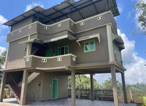 a house that is shaped like a house at Holiday homes by Friday Retreats in Pīrmed