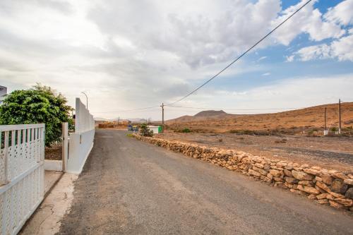 an empty road in the middle of a desert at Villa Brisa de Gairia in Antigua