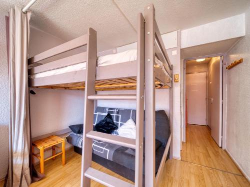 a room with two bunk beds in a room at Studio Soyouz Vanguard-102 by Interhome in Le Corbier