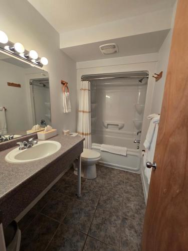 a bathroom with a sink and a toilet at Travelodge by Wyndham Port Elgin in Port Elgin