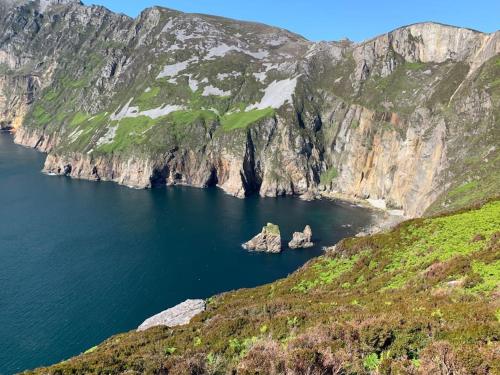 an island in the middle of a body of water at Cosy Studio Cabin set in nature with stove in Killybegs