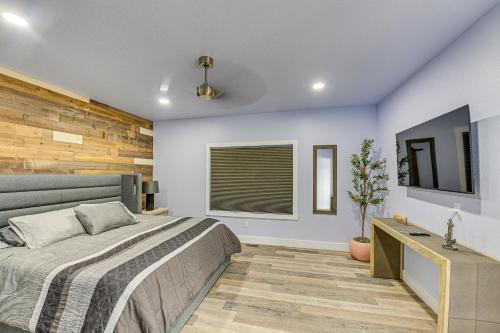 a bedroom with a large bed and a window at Modern and Spacious Luxe Home in Remote Fort Peck! in Park Grove
