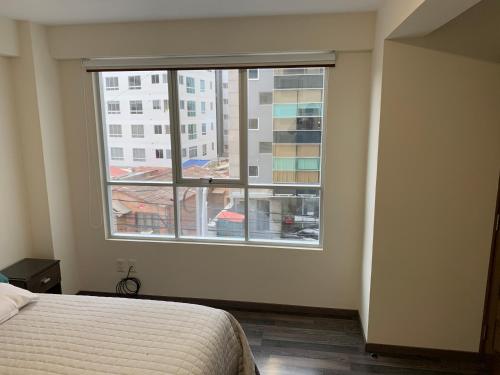 Ένα ή περισσότερα κρεβάτια σε δωμάτιο στο Cómodo y bien ubicado departamento en La Paz