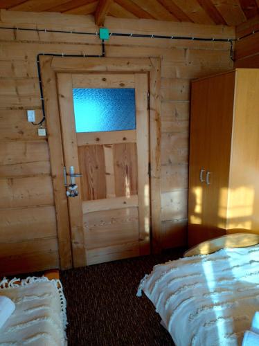 Postel nebo postele na pokoji v ubytování Halne Izby - Pokoje Gościnne