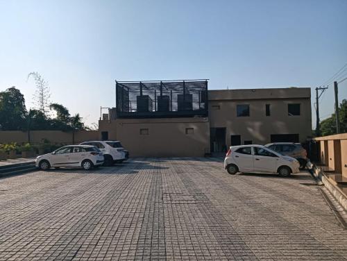 a group of cars parked in a parking lot at Best Western Swaran Amritsar in Amritsar