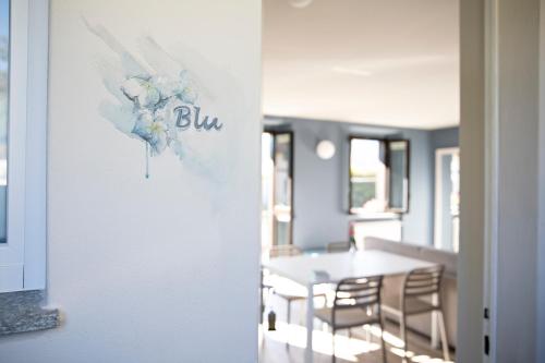 a dining room with a table and chairs at CHARMING MOMENT di Villa Porta - Residenza Ortensia in Luino