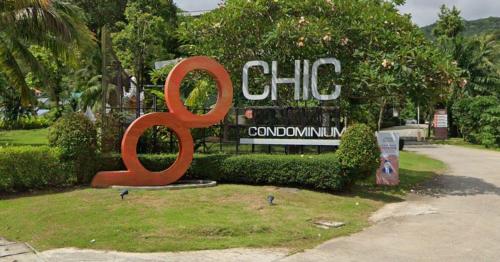 a large red sign in front of a building at AtKaronWithChadaB311 in Karon Beach