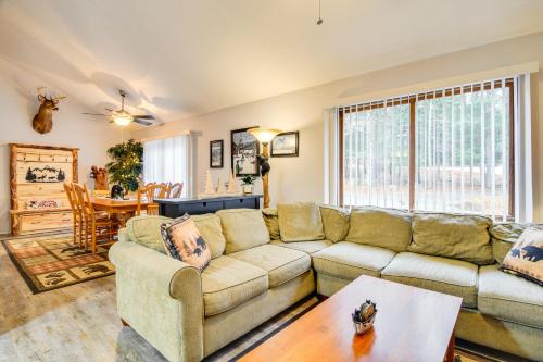 a living room with a couch and a table at Cozy Bartlett Condo with Deck and Resort Amenities! in Bartlett