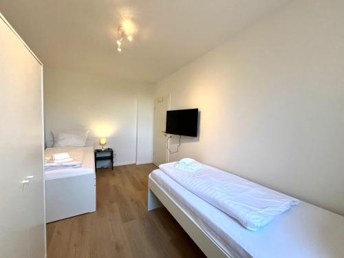Ένα ή περισσότερα κρεβάτια σε δωμάτιο στο GuestHouse Bielefeld