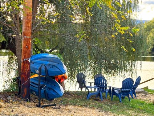 a group of chairs and a table with a raft at Saugerties Waterfront Getaway in Saugerties