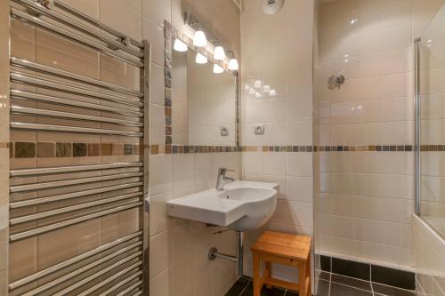 a bathroom with a sink and a shower at Chalet le Regain in Villard-Reculas