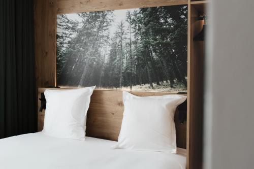 Chalet Hôtel Quartzにあるベッド