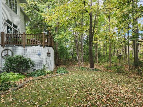 a house with a deck on the side of it at Simon in Kaukauna