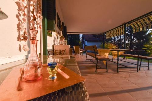 a vase sitting on a table on a patio at Vila Valentina in Irig