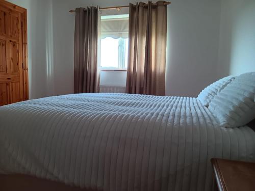 Una cama o camas en una habitación de Global Guest Ireland