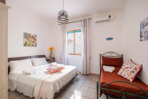 Ένα ή περισσότερα κρεβάτια σε δωμάτιο στο Summer Sunshine Private Villa