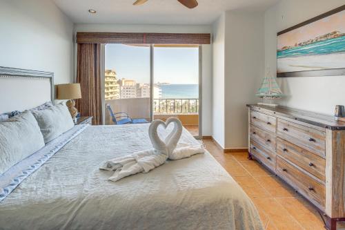 a bedroom with a large bed with a swan towel at 350 Sq Ft Balcony Oceanfront Puerto Peñasco Villa in Puerto Peñasco