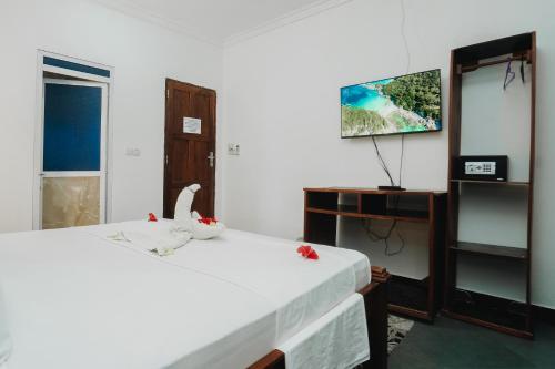 Postel nebo postele na pokoji v ubytování Tamu House Pajé Beach