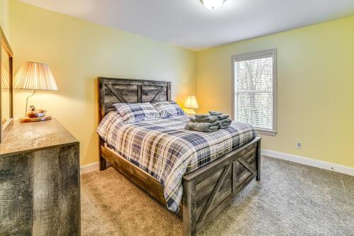 a bedroom with a bed and a window at Mountain Views and Brook Access Home in Arkville! in Arkville