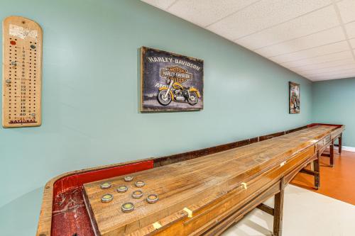 a long bench in a room with a picture on the wall at Mountain Views and Brook Access Home in Arkville! in Arkville