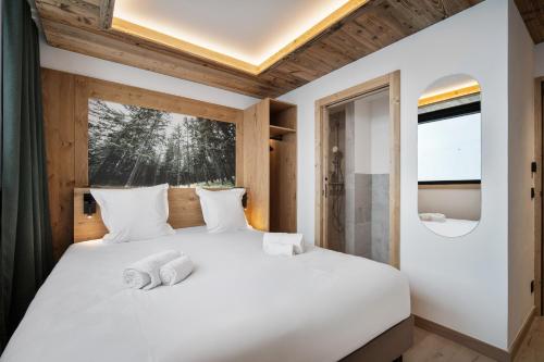Chalet Hôtel Quartzにあるベッド
