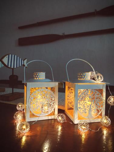 two boxes with lights on them on a table at Villa Anna 300 m dal mare in Torre delle Stelle