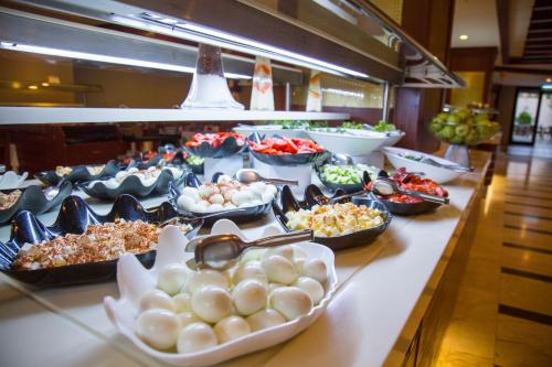 a buffet line with many different types of food at Alder Resort Hotel in Kemer