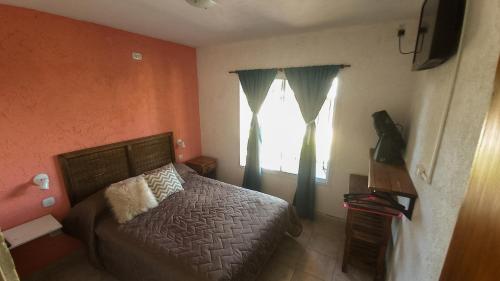 Ένα ή περισσότερα κρεβάτια σε δωμάτιο στο PUEBLO MIO