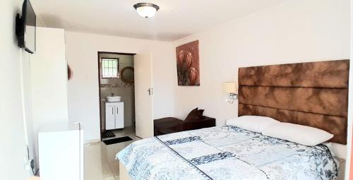 Ένα ή περισσότερα κρεβάτια σε δωμάτιο στο Royal Chestnut Guesthouse