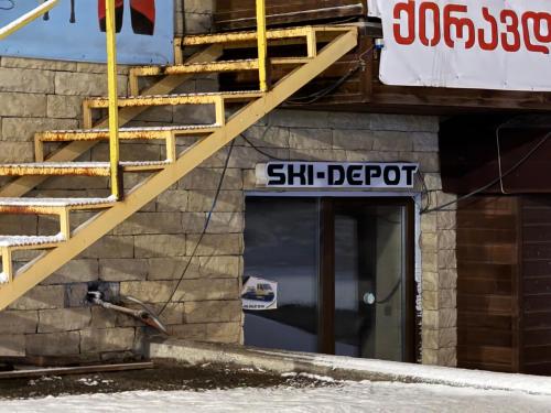 a sign on a building with a stair depository at Giorgi Apartment In New Gudauri - Block 3 - N315 in Gudauri