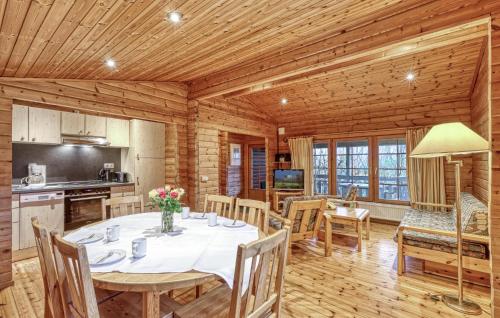 a dining room and kitchen with a table and chairs at Nice Home In Masserberg With Wifi in Fehrenbach