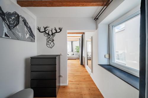 a hallway of a house with a deer head on the wall at Innsbruck City Chalet in Innsbruck